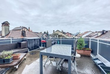 Au coeur de la ville : Immeuble résidentiel et commercial